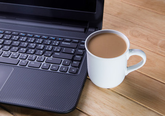 Coffee cup with the computer.