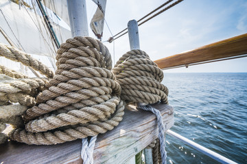 Wooden pulley and ropes on old yacht. - obrazy, fototapety, plakaty