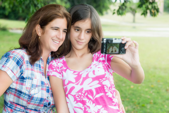 Teen and her young mother taking a self picture