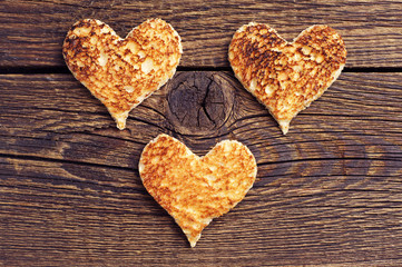 Three toast bread in the shape of hearts