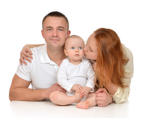 Young family mother and father with newborn child baby girl