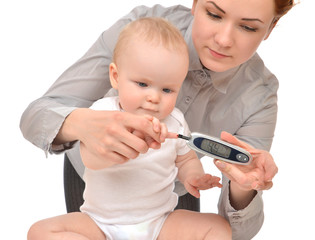 measuring glucose level blood test from diabetes child baby