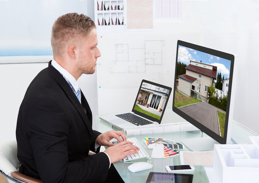 Businessman checking a property portfolio online