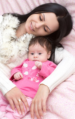 Young happy mother with baby