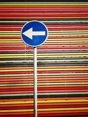 Foto op Plexiglas road-sign on multicolored  strips background © ryszard filipowicz