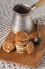 Caramel Florentines cookies on a wooden cutting board