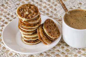 Caramel Florentines cookies on a wooden cutting board