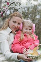 Happy mother and child with Easter decoration