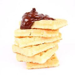 Waffles covered with chocolate on a white background
