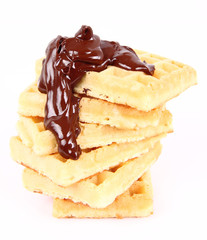 Waffles covered with chocolate on a white background