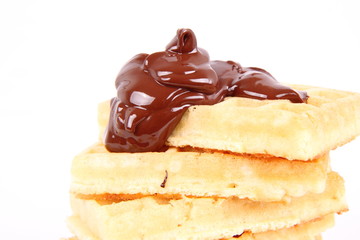 Waffles covered with chocolate on a white background
