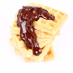 Waffles covered with chocolate on a white background