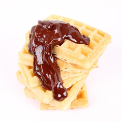 Waffles covered with chocolate on a white background