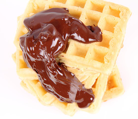 Waffles covered with chocolate on a white background