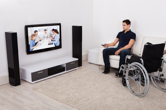 Handicap Man Watching Television In Living Room