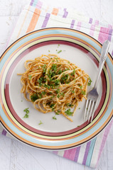 spaghetti with red pesto and parsley