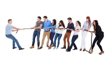 Group of people having a tug of war