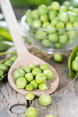 Fresh Peas on a cooking spoon