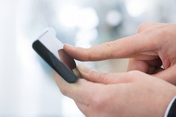 Businesswoman's Hands Using Smartphone