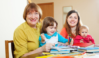 Fototapeta premium senior woman with daughter and grandchildren at home.