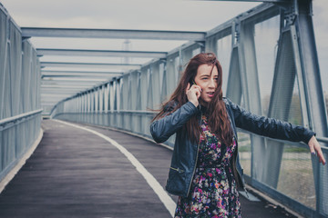 Pretty girl with long hair talking on phone