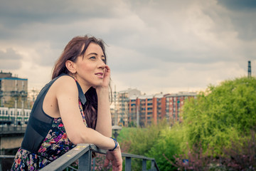 Pretty girl posing on railroad bridge