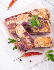 .Smoked lamb ribs on wooden table.