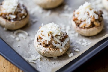 Mushroom champignons stuffed with filling of chicken, cheese