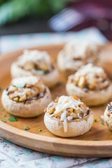 Mushroom champignons stuffed with filling of chicken, cheese