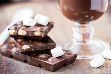 Tile dark chocolate with hazelnuts, marshmallows, hot drink