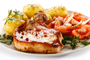 Grilled steak, boiled potatoes and vegetable salad
