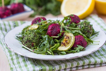 Fresh summer salad with arugula, zucchini, balls of beet