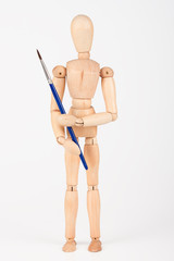 Plain wood mannequin stand upright isolated on white holding pai