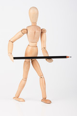 Small wood mannequin standing with colour pencil isolated on whi