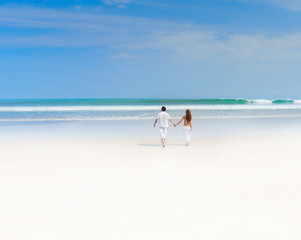 Fototapeta na wymiar Young couple on a beach