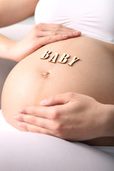 Brzuch kobiety w ciąży - obrazy, fototapety, plakaty