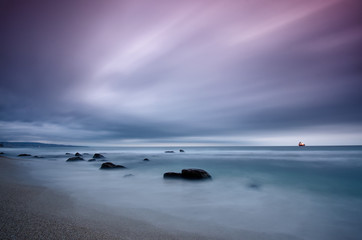 Fototapeta na wymiar Stormy sea before sunrise