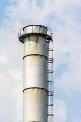 Factory Chimney Of Coal Power Plant Against Blue Sky