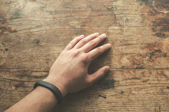 Hand wearing fitness tracker band