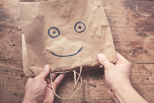 Smiling face on paperbag