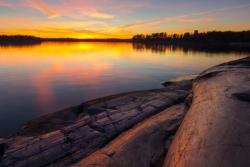 Beach rock with sunrise in coast of  Helsinki