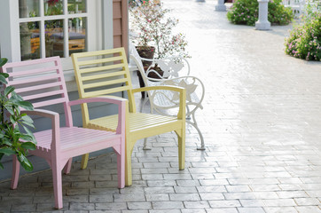Fototapeta na wymiar Pink and yellow wooden chair