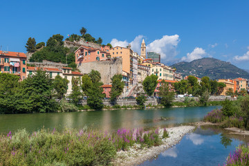 Shallow stream and old town of Ventimiglia, Italy.