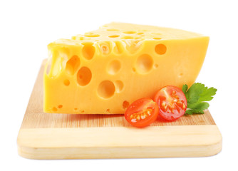 Piece of cheese and tomatoes, on wooden board, isolated on