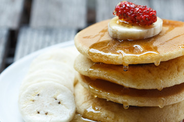 Stack of delicious pancakes with fresh fruits