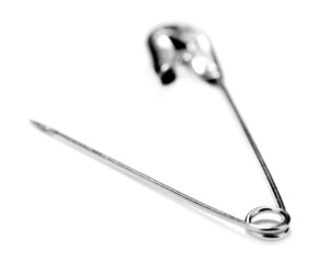 Safety pin isolated on white