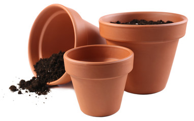 Clay flower pots and soil, isolated on white