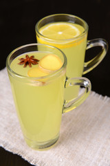 Healthy ginger tea with lemon and honey on table close-up