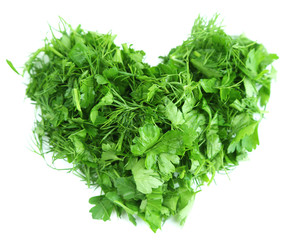 Fototapeta na wymiar Heart shape of chopped herbs, isolated on white