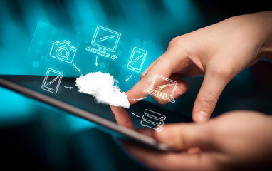 Finger pointing on tablet pc, mobile cloud concept